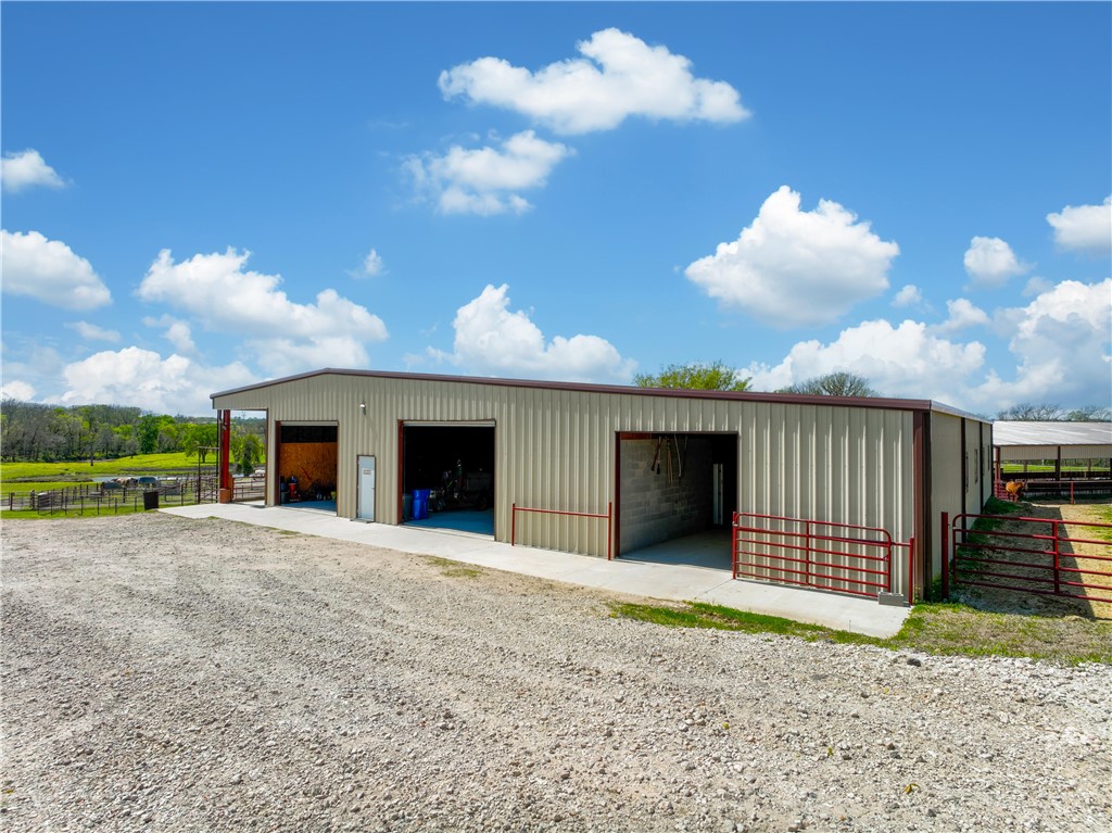 2289 Old Dobbin Road Montgomery, TX 77316 - Photo 44 of 50 a view of a house with a yard and garage