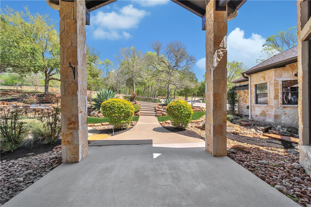 2289 Old Dobbin Road Montgomery, TX 77316 - Photo 8 of 50 a view of a porch with a floor to ceiling window wooden fence and a porch