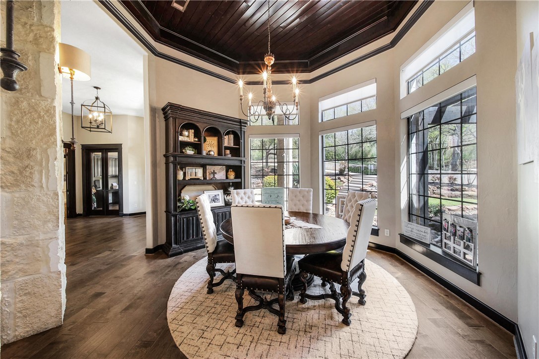 2289 Old Dobbin Road Montgomery, TX 77316 - Photo 10 of 50 a dining room with furniture a chandelier and wooden floor