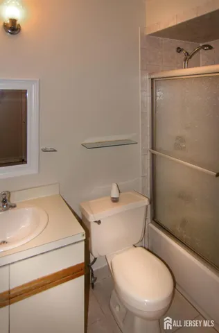 a white toilet sitting next to a bathroom sink