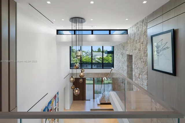 a view of an entryway with a floor to ceiling window