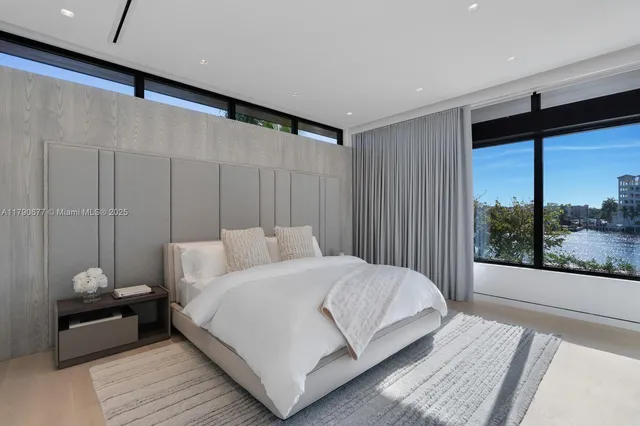 a lobby with furniture and a floor to ceiling window