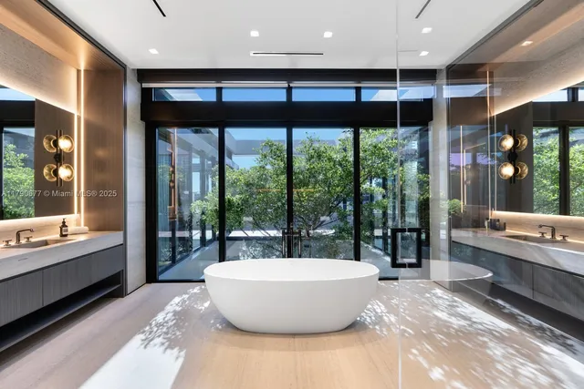 a livingroom with furniture and a large window