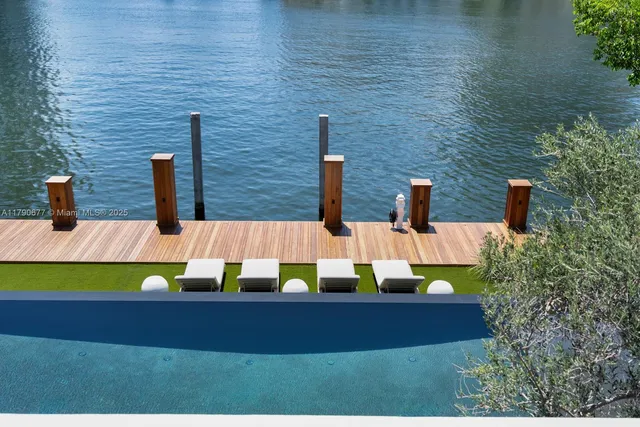 a bedroom with furniture and a large window