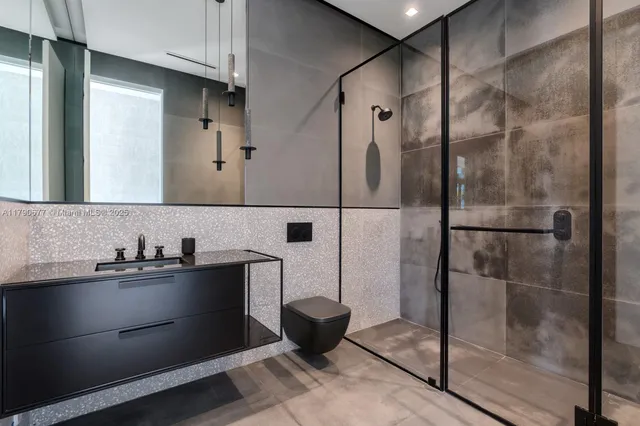 a aerial view of a house with swimming pool garden and patio