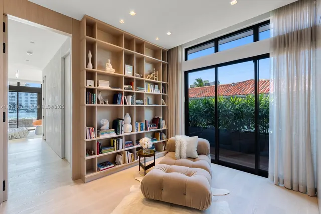 a view of a brick house with many windows and wooden floor
