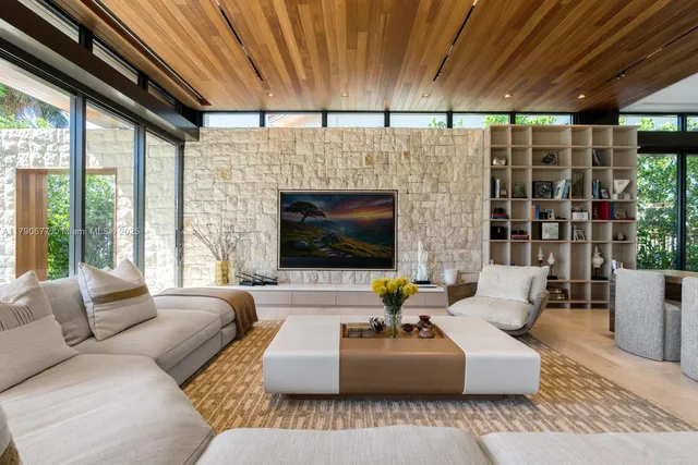 a living room with furniture and a table