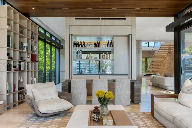 a kitchen with granite countertop a sink and chairs