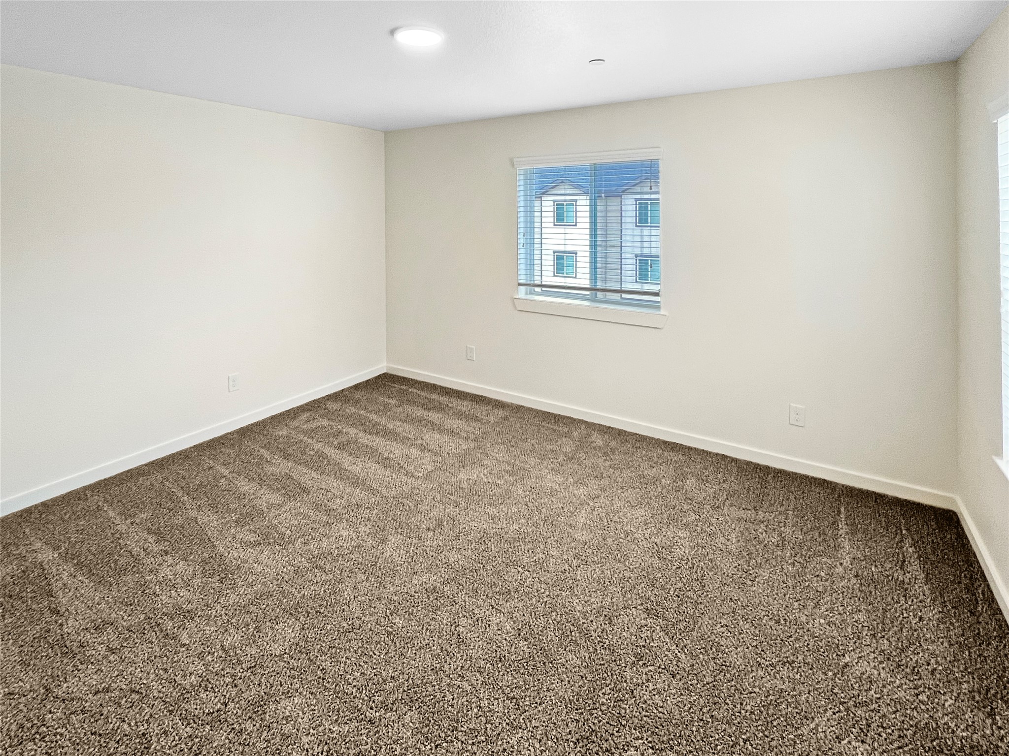 12603 Telge Road, Unit 8EH Cypress, TX 77429 - Photo 18 of 32 an empty room with windows