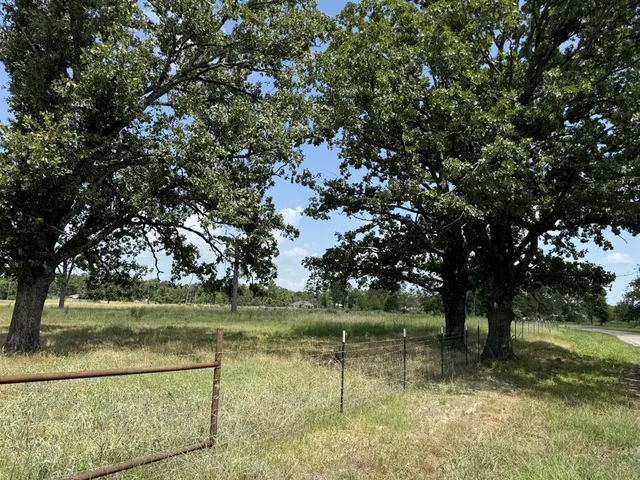 a view of lake with green space