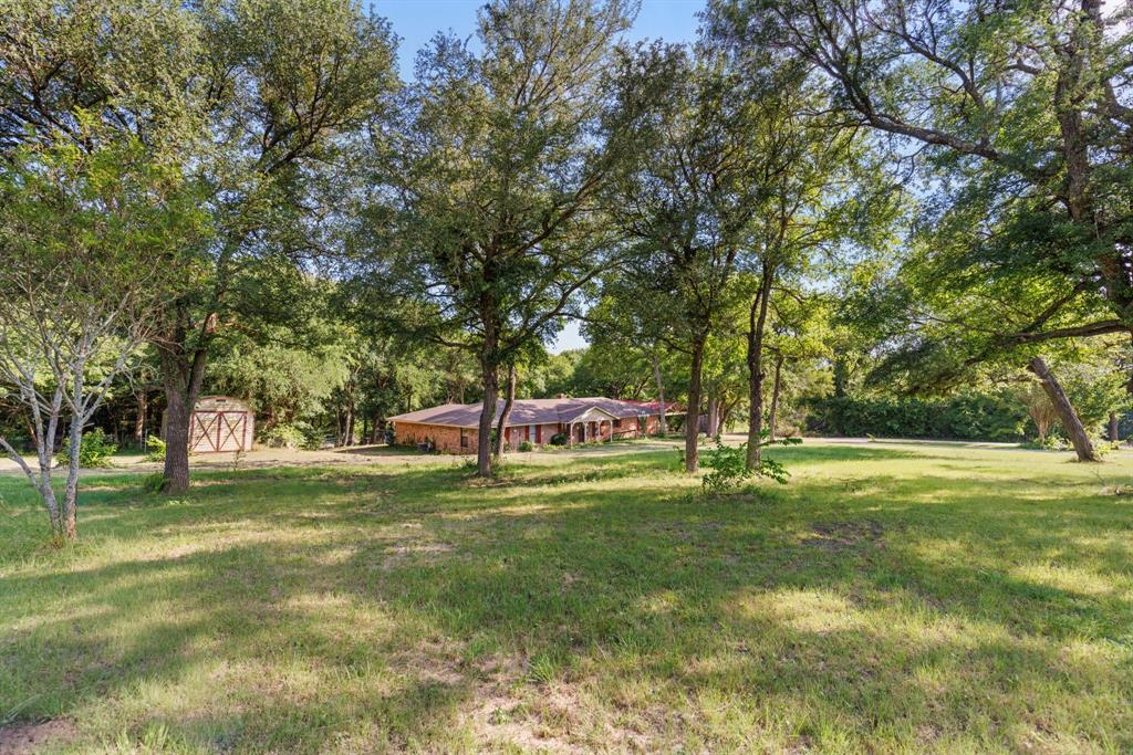 13539 Chapel Road Lorena, TX 76655 - Photo 29 of 37 Expansive grassy lot featuring mature trees providing ample shade