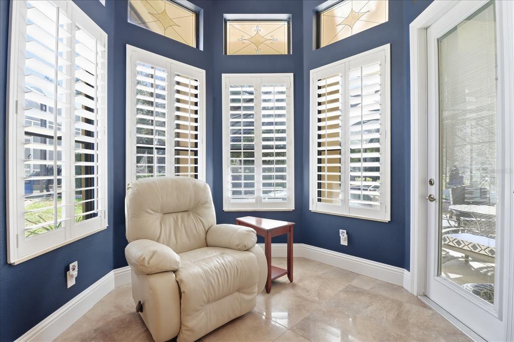1416 North Ridge Meadow Path Hernando, FL 34442 - Photo 32 of 68 a living room with furniture and a large window