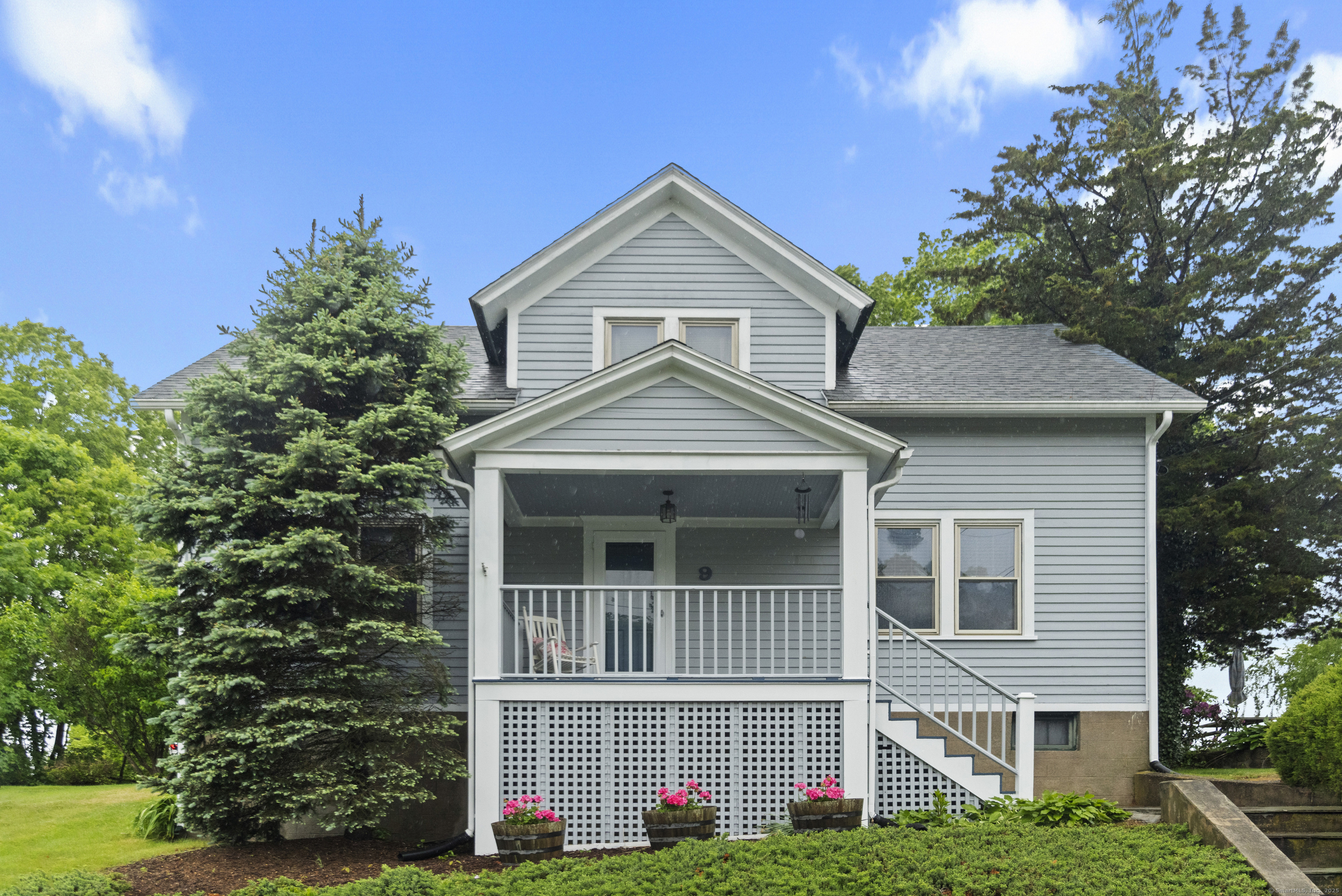 a front view of a house with garden