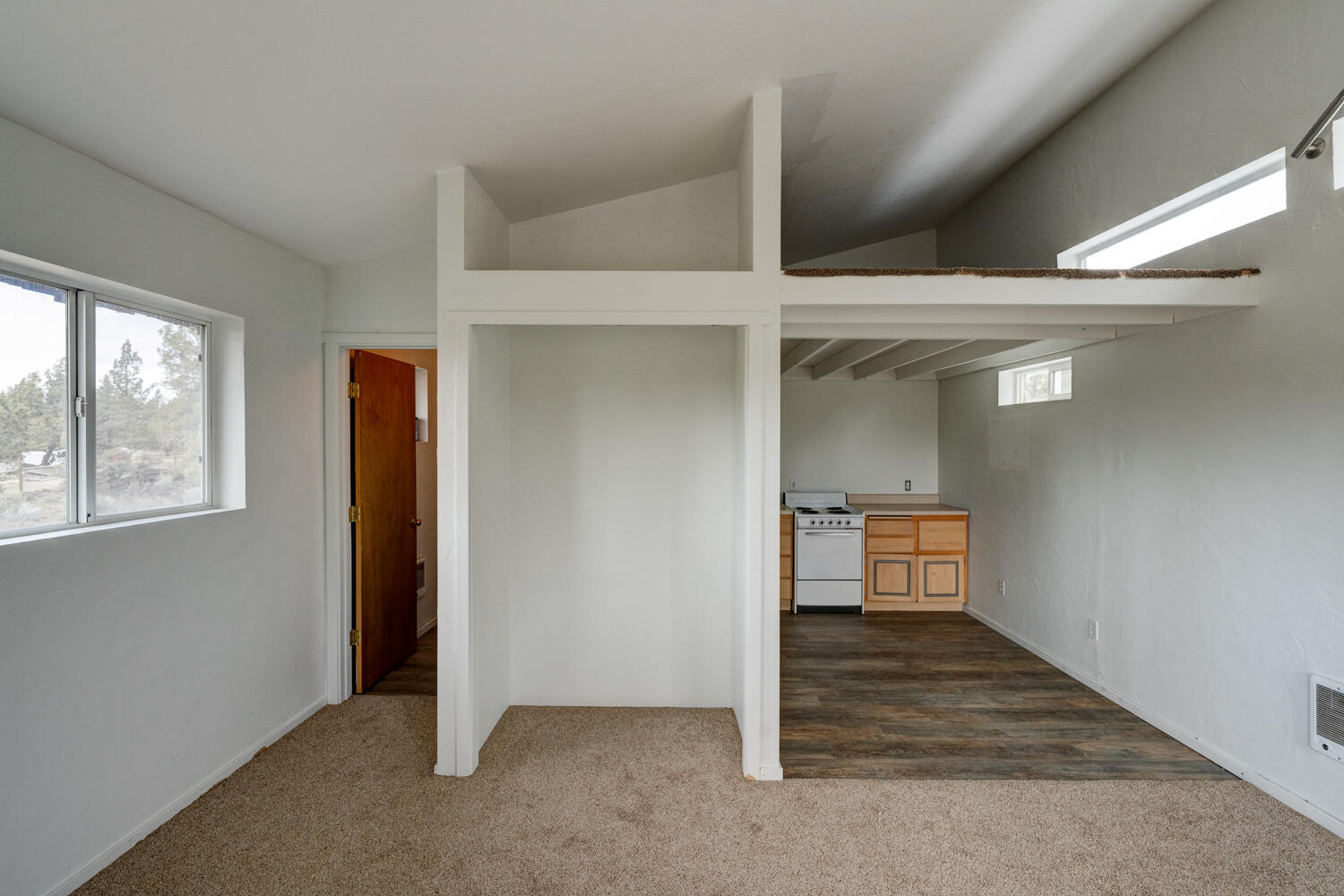 64925 McGrath Road Bend, OR 97701 - Photo 42 of 51 Bunk/storage loft area above kitchen. Potential washer/dryer hookup on ground floor in shop