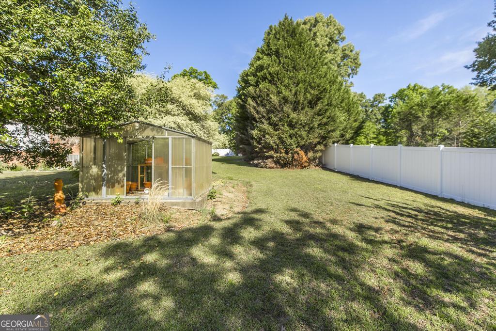 201 Strawberry Circle Dublin, GA 31021 - Photo 12 of 40 a view of yard with tree in front of it