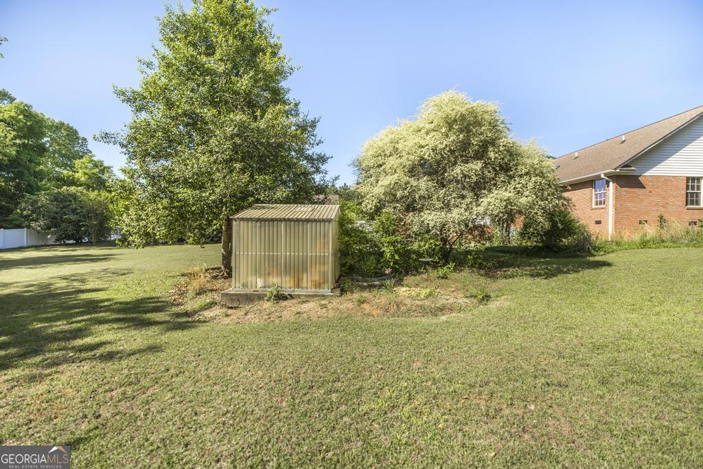 201 Strawberry Circle Dublin, GA 31021 - Photo 13 of 40 a view of a house with a yard