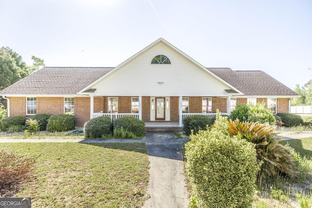 201 Strawberry Circle Dublin, GA 31021 - Photo 15 of 40 a front view of a house with a yard