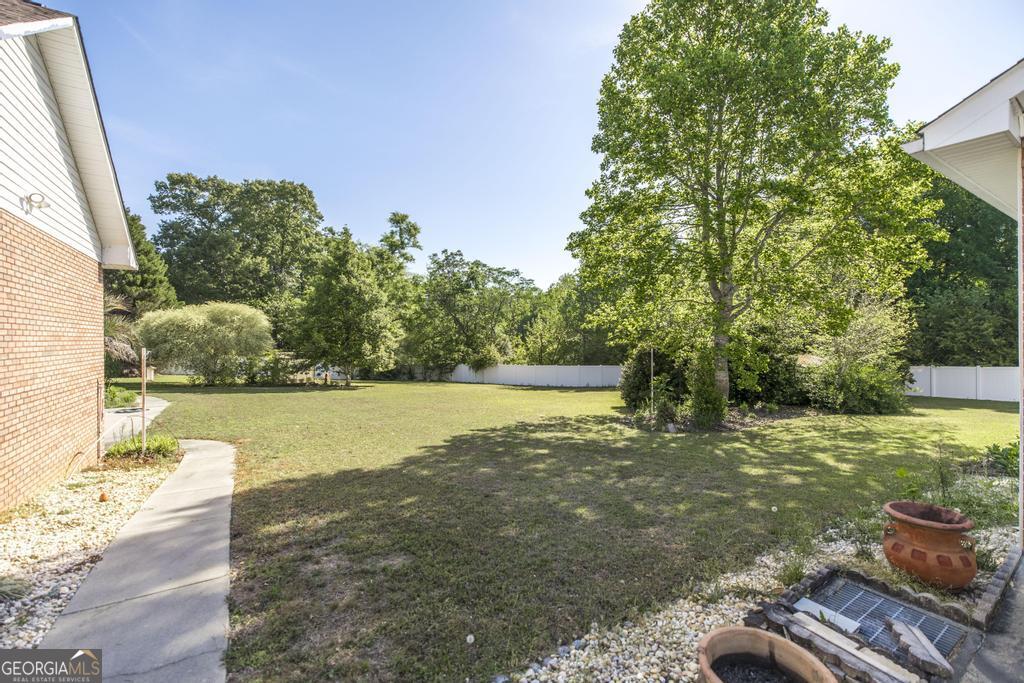 201 Strawberry Circle Dublin, GA 31021 - Photo 16 of 40 a view of a yard with an outdoor space