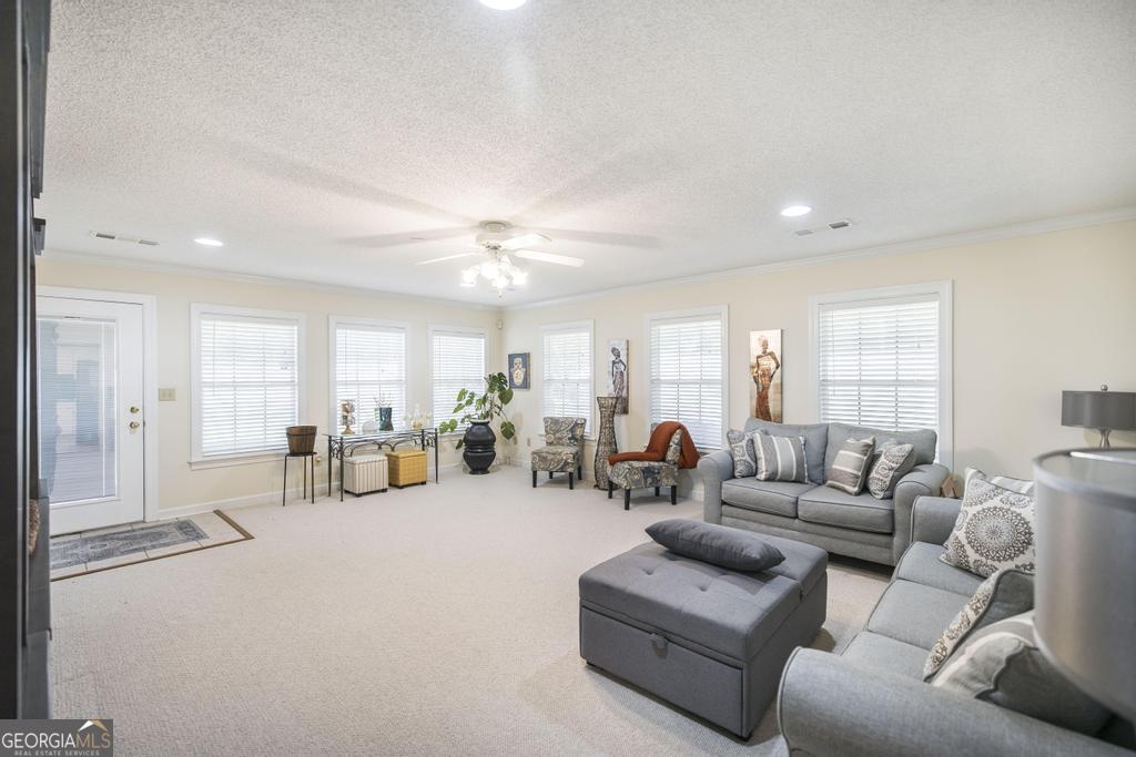201 Strawberry Circle Dublin, GA 31021 - Photo 23 of 40 a living room with furniture and a large window