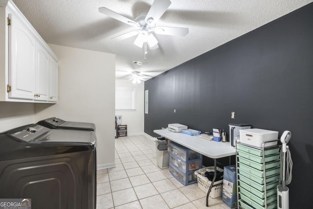 201 Strawberry Circle Dublin, GA 31021 - Photo 31 of 40 a kitchen that has a cabinets a sink and a stove