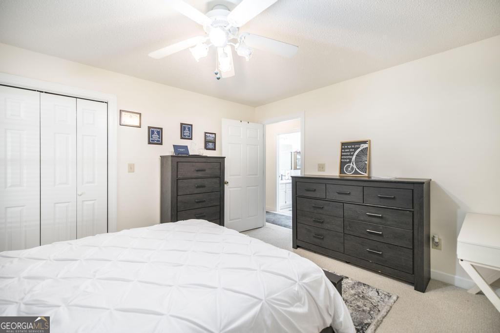 201 Strawberry Circle Dublin, GA 31021 - Photo 34 of 40 a bedroom with a bed and a dresser