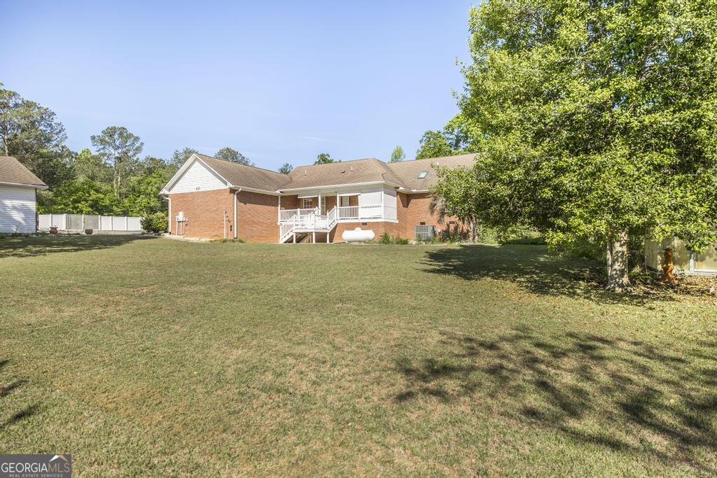 201 Strawberry Circle Dublin, GA 31021 - Photo 4 of 40 a view of a house with a yard