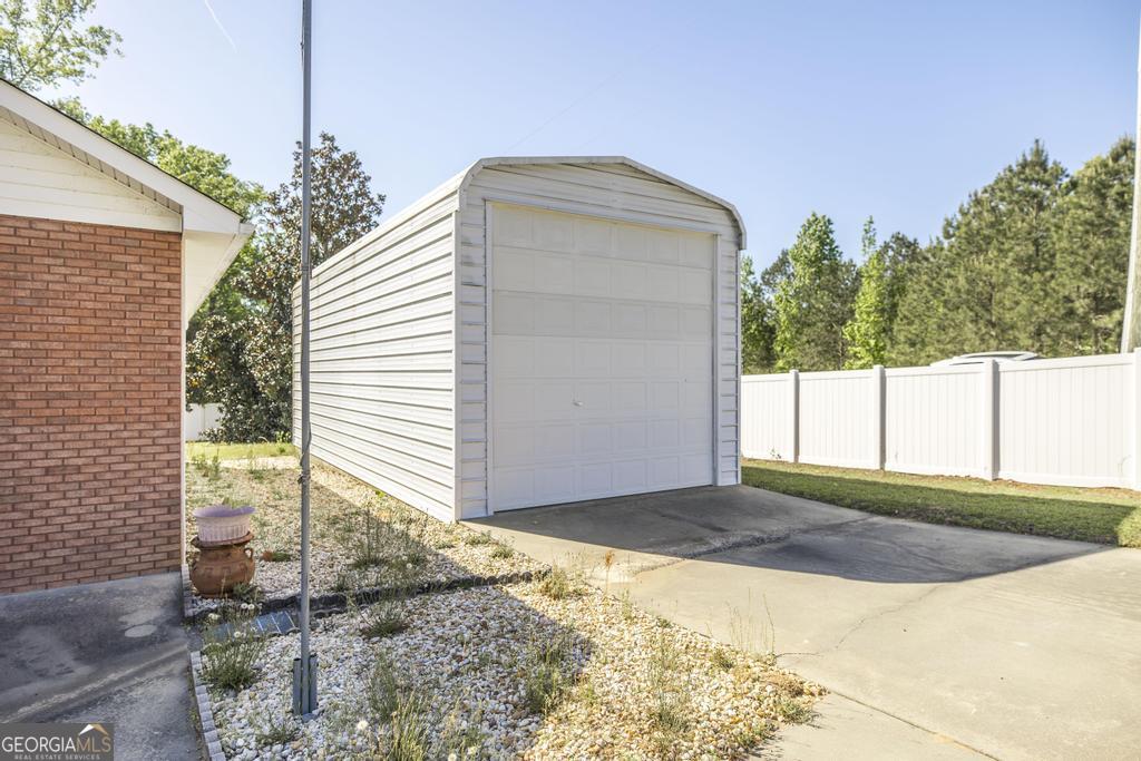 201 Strawberry Circle Dublin, GA 31021 - Photo 9 of 40 a view of backyard with a small cabin