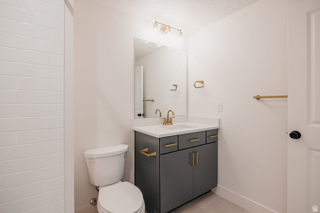 5902 Canyon Rim Road, Unit 620 Lehi, UT 84048 - Photo 59 of 78 Vanity with a white countertop and gold-tone fixtures