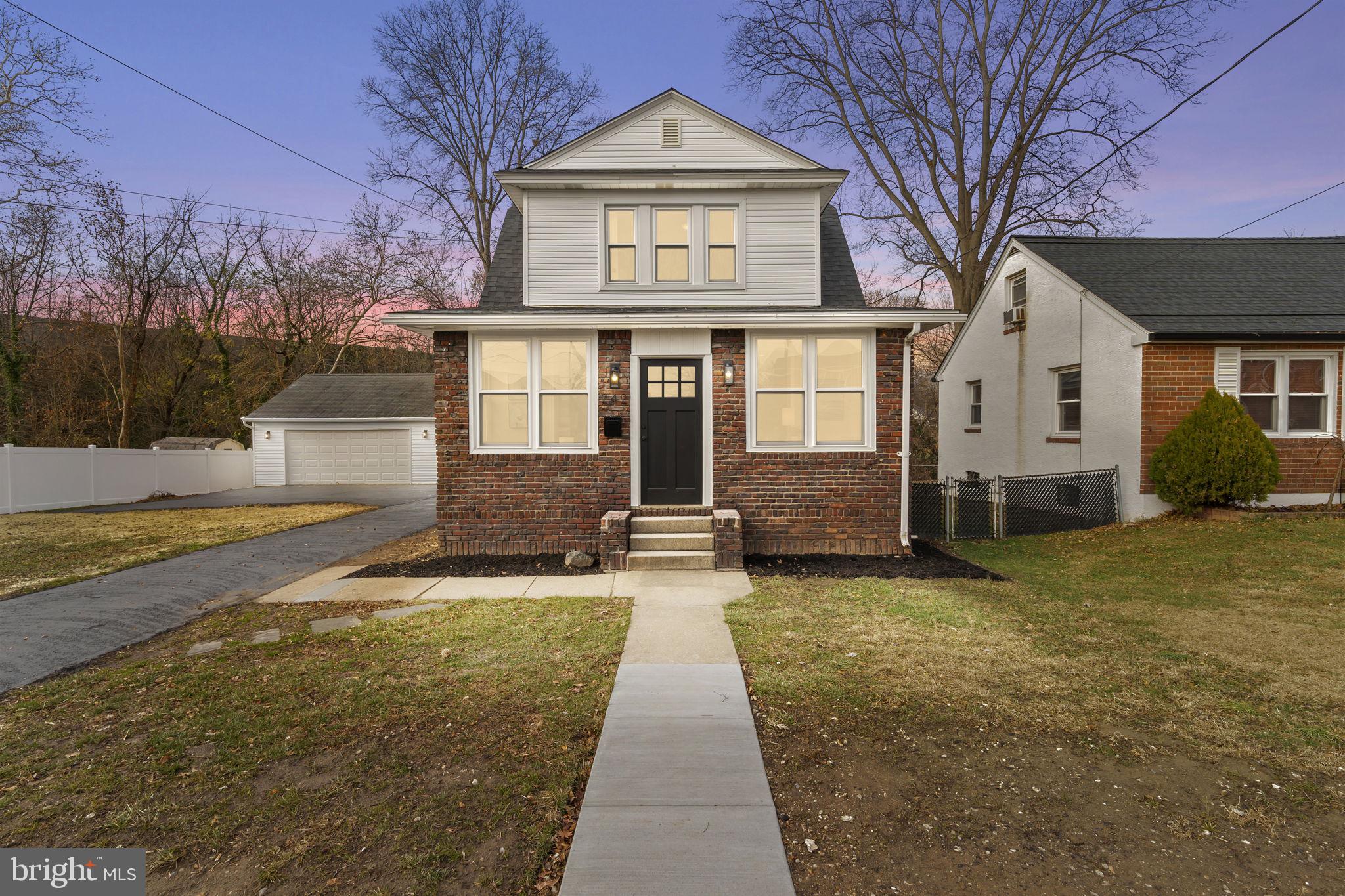 242 Willard Drive Ridley Park, PA 19078 - Photo 1 of 72 a front view of a house with yard