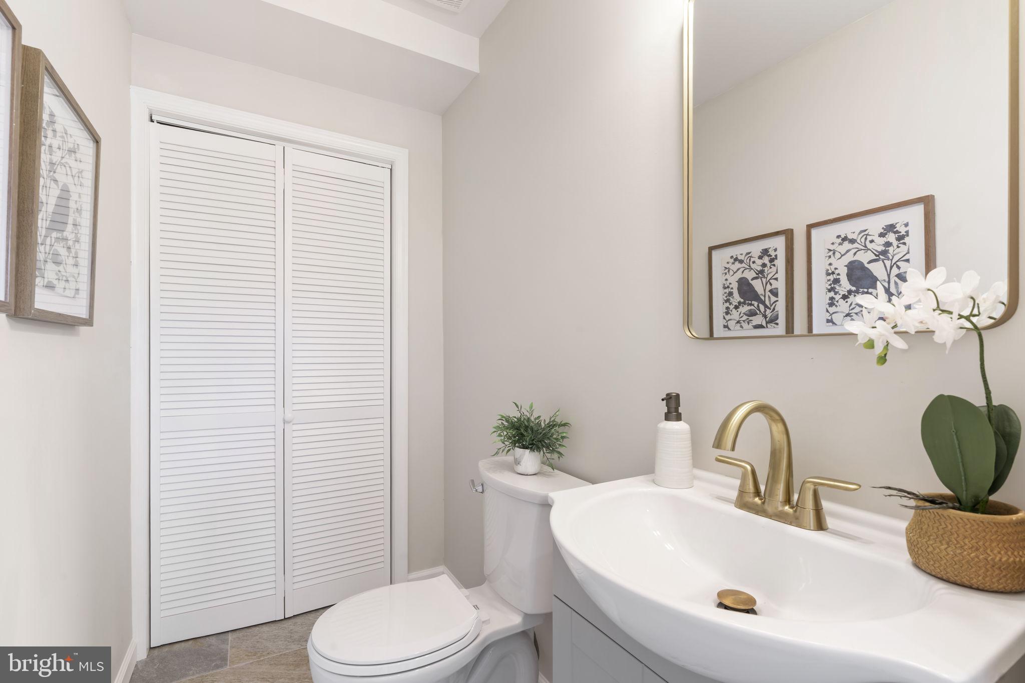242 Willard Drive Ridley Park, PA 19078 - Photo 44 of 72 a bathroom with a sink a toilet and a mirror