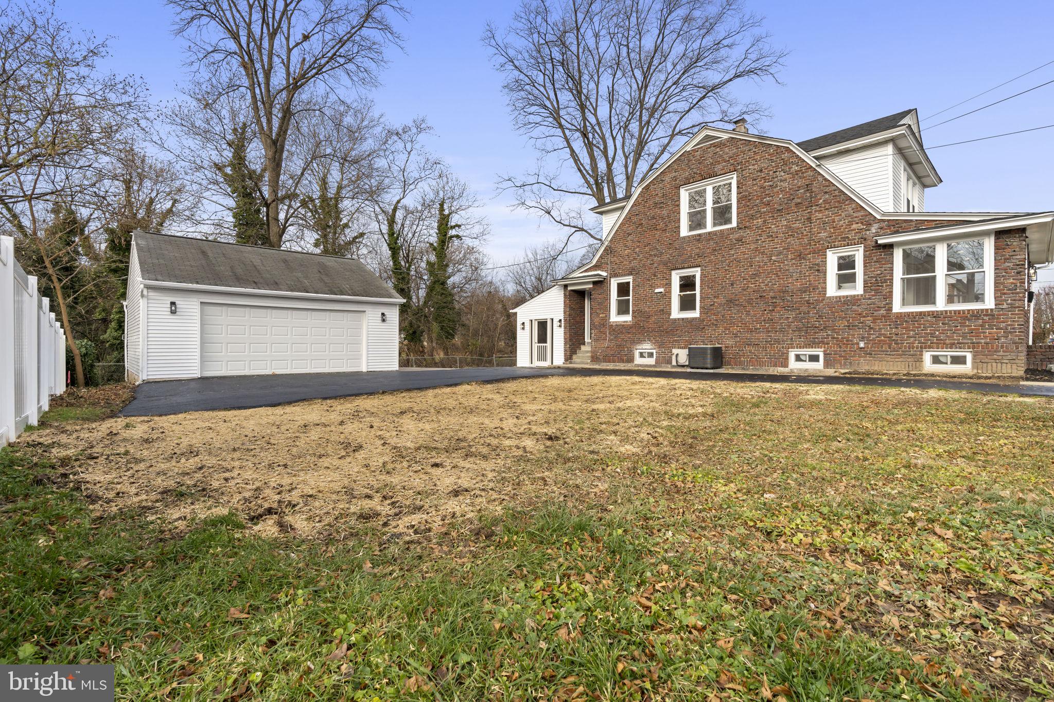 242 Willard Drive Ridley Park, PA 19078 - Photo 54 of 72 a front view of a house with a yard