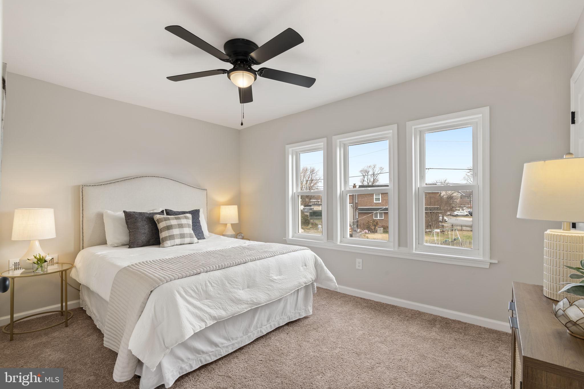 242 Willard Drive Ridley Park, PA 19078 - Photo 59 of 72 a bedroom with a large bed and a large window