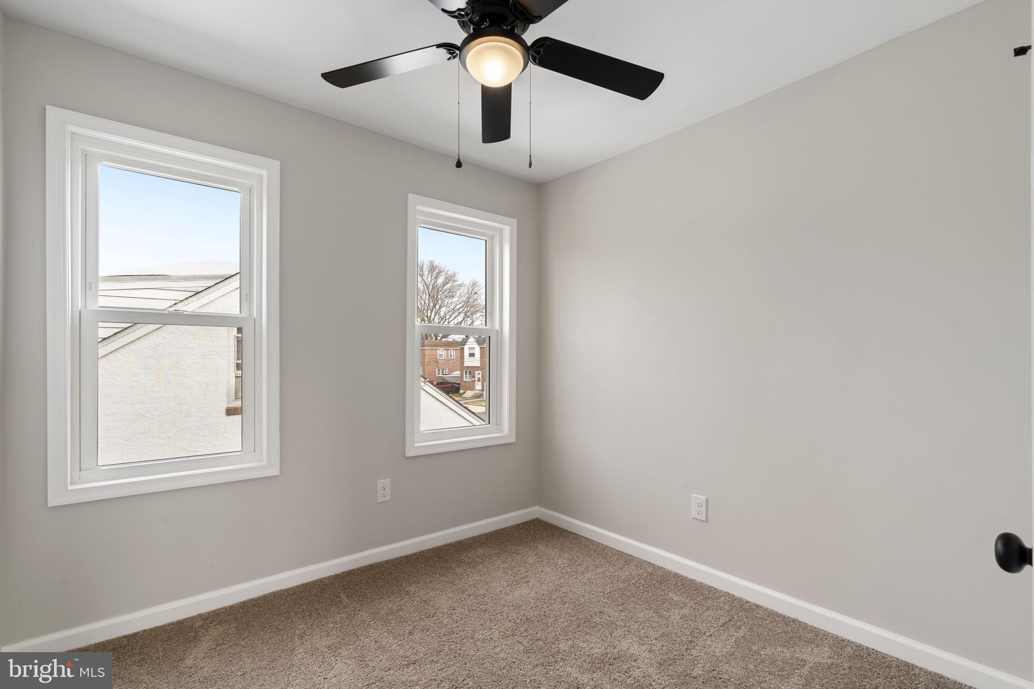 242 Willard Drive Ridley Park, PA 19078 - Photo 64 of 72 an empty room with windows and fan
