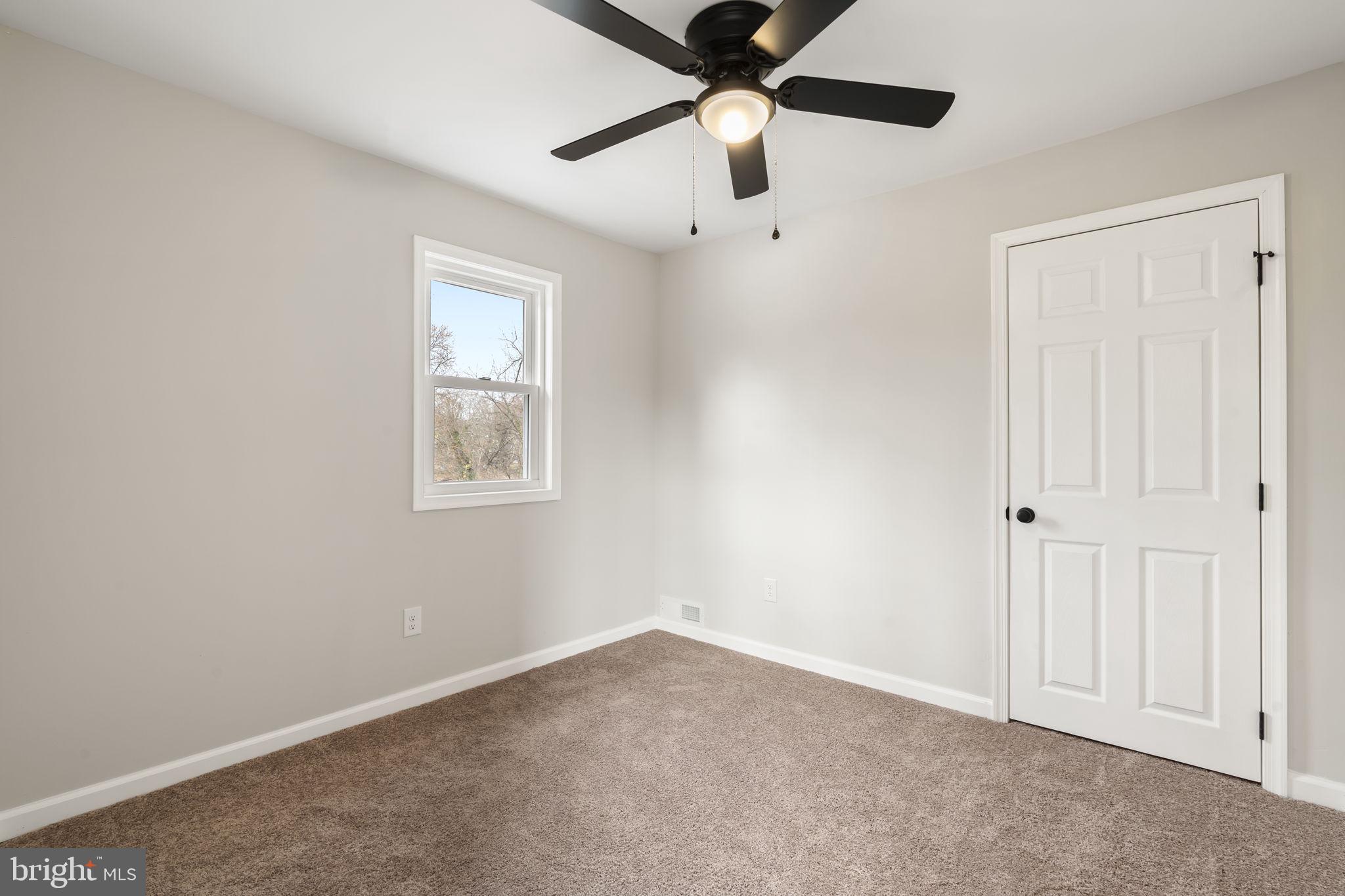 242 Willard Drive Ridley Park, PA 19078 - Photo 65 of 72 an empty room with windows and fan