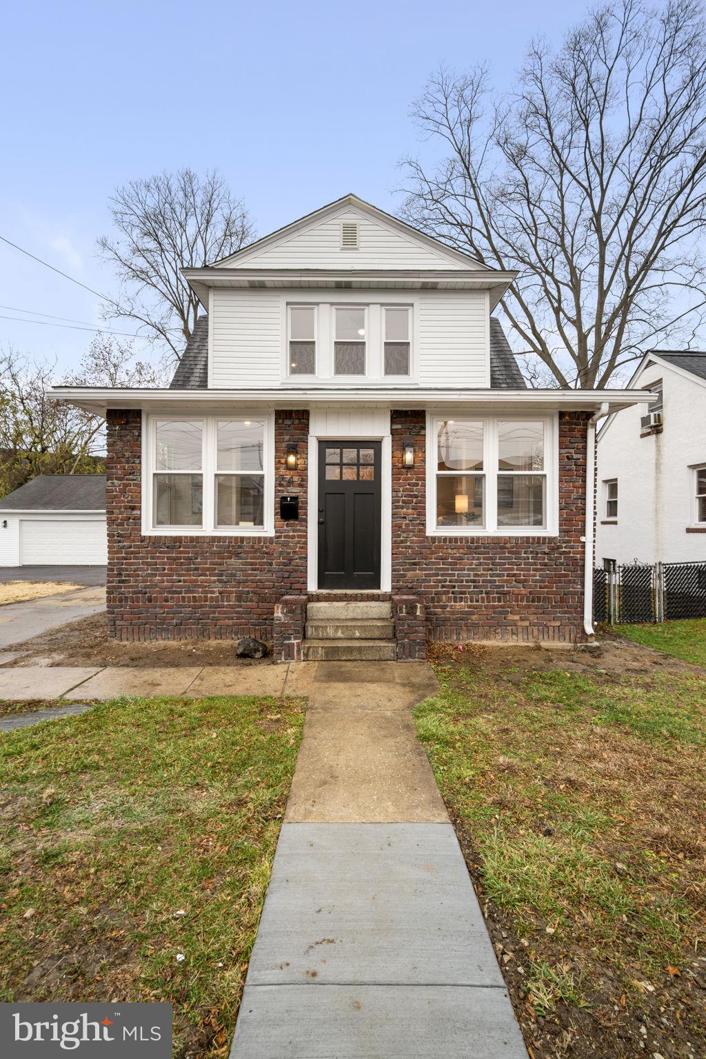 242 Willard Drive Ridley Park, PA 19078 - Photo 69 of 72 a front view of a house with a yard