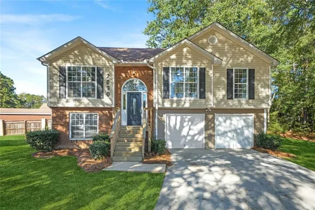 front view of a house with a yard