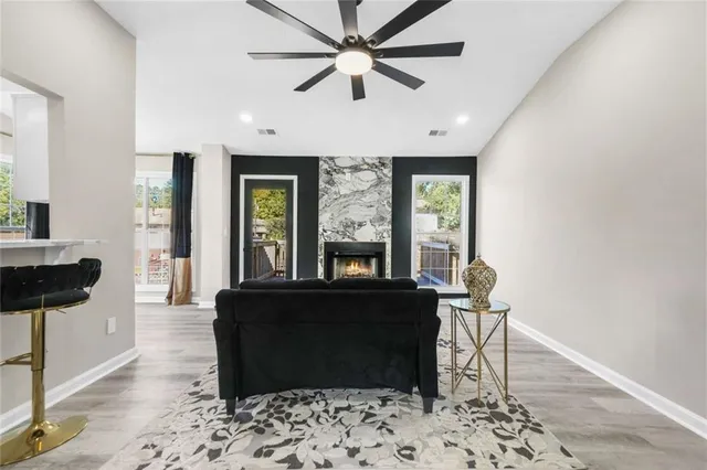a living room with furniture and a large window