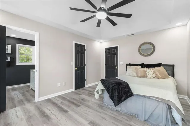 a bedroom with a bed and window