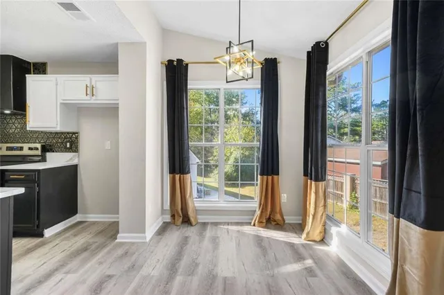 a view of kitchen with furniture and large window