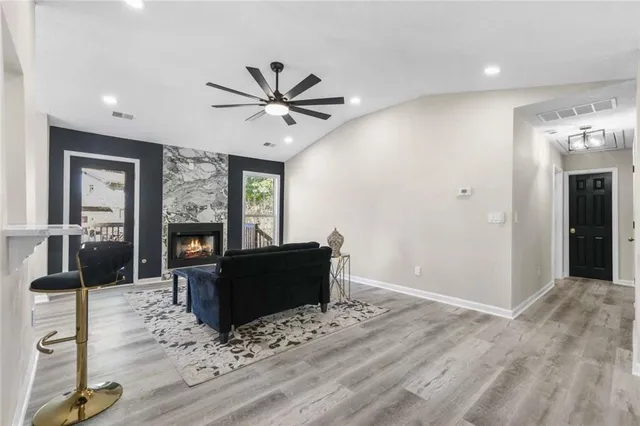 a living room with furniture and a fireplace