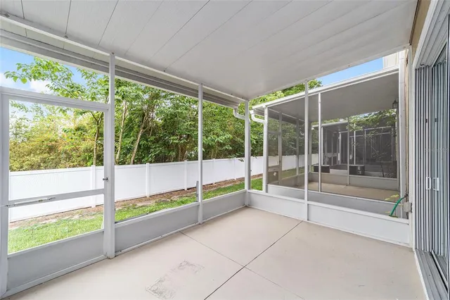 a view of an empty room with windows