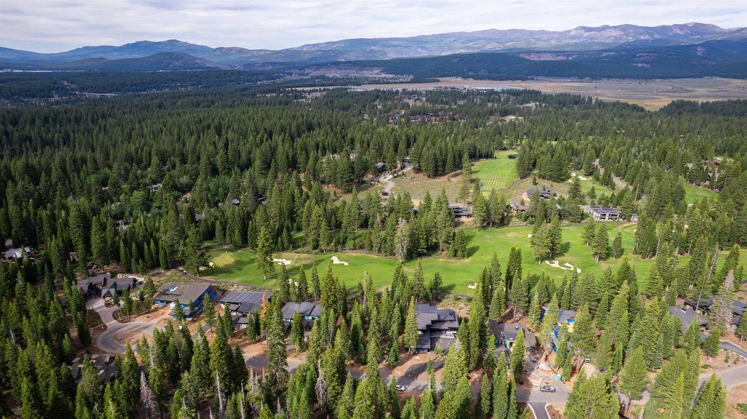 9247 Brae Court Truckee, CA 96161 - Photo 7 of 16 a view of a lush green hillside and houses