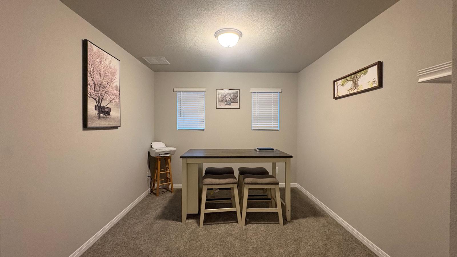 6511 Dragride Road Buda, TX 78610 - Photo 27 of 36 A well-proportioned interior room featuring ample wall space and natural light from two windows.
