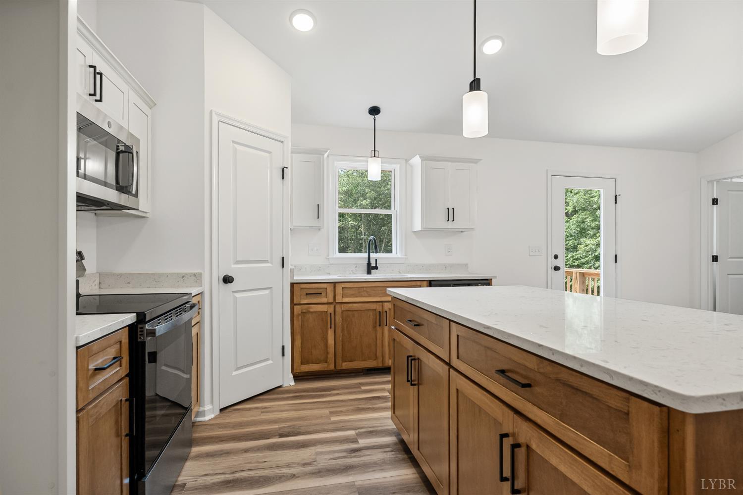 2541 Mitchell Mill Road Gladys, VA 24554 - Photo 12 of 44 a kitchen with a sink stove and refrigerator