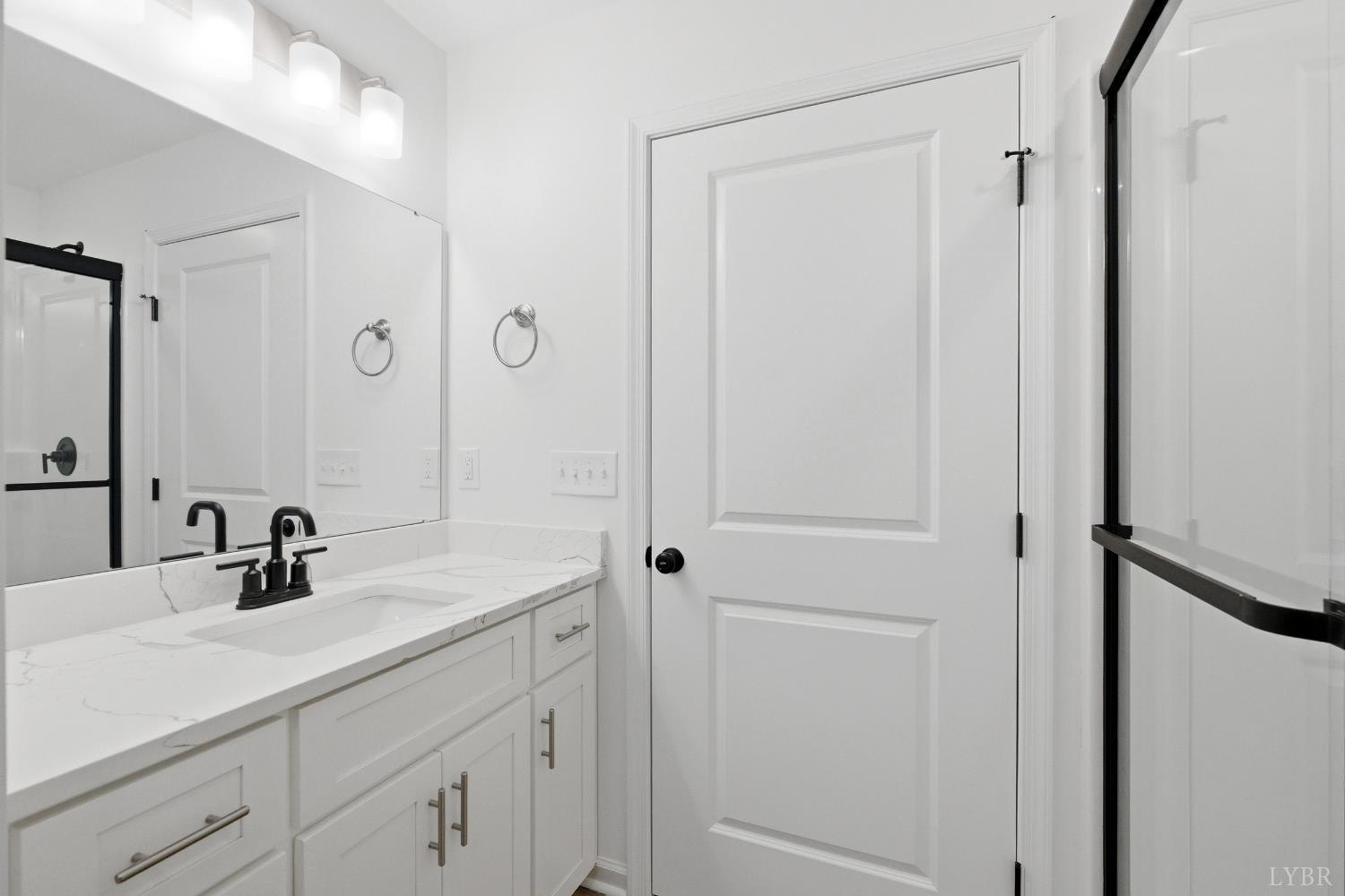 2541 Mitchell Mill Road Gladys, VA 24554 - Photo 12 of 41 a bathroom with a sink and a mirror
