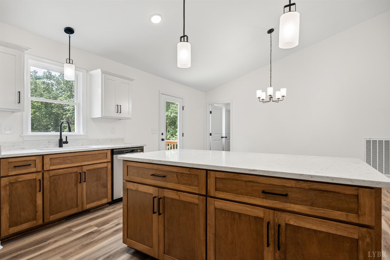 2541 Mitchell Mill Road Gladys, VA 24554 - Photo 13 of 44 a kitchen with a sink chandelier and stove