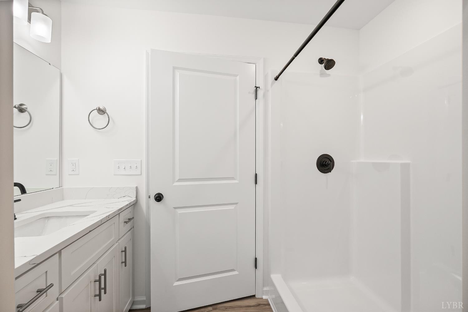 2541 Mitchell Mill Road Gladys, VA 24554 - Photo 20 of 44 a bathroom with a shower sink and mirror