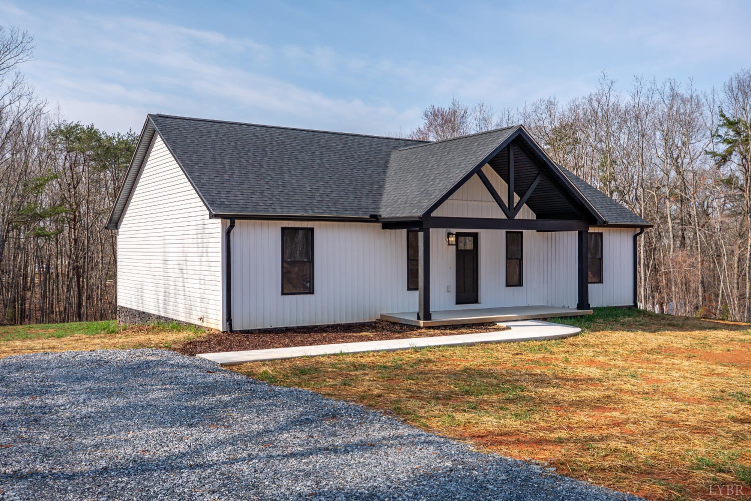 2541 Mitchell Mill Road Gladys, VA 24554 - Photo 22 of 41 a view of house with yard and trees in the background
