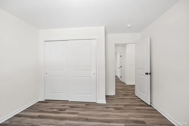 a bathroom with a sink a toilet a mirror and shower