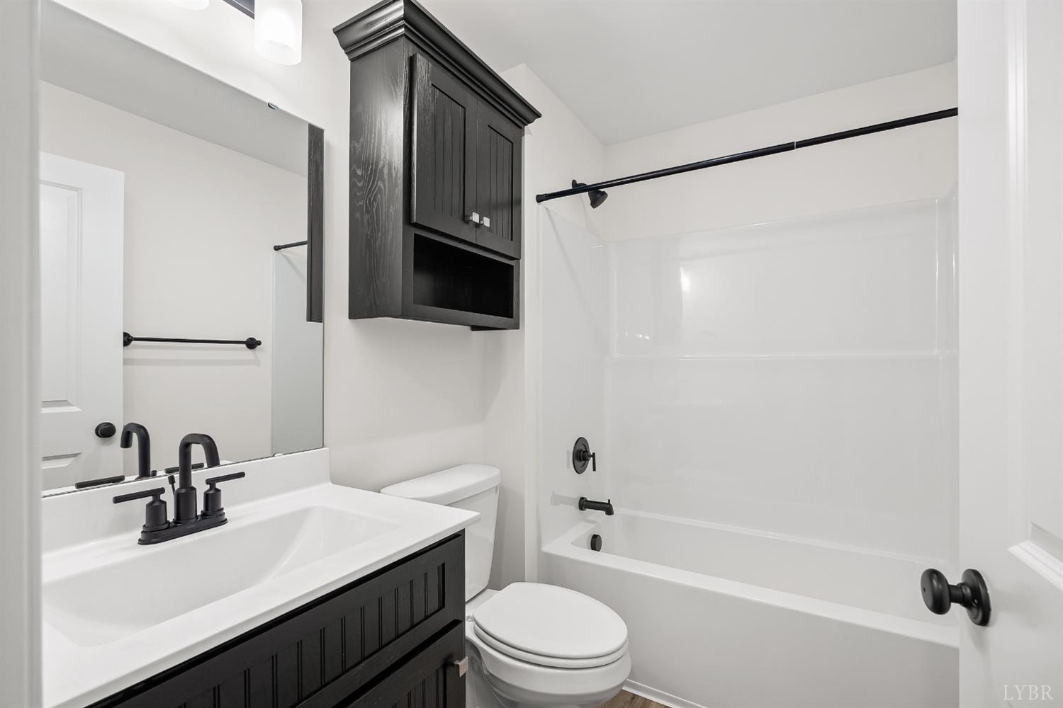 2541 Mitchell Mill Road Gladys, VA 24554 - Photo 26 of 44 a bathroom with a sink a toilet a mirror and shower